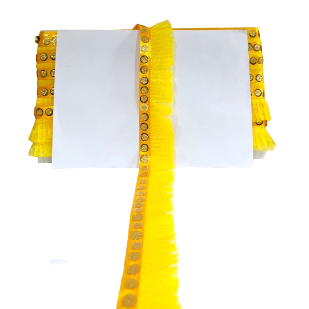 White blouse with yellow ruffled sleeves and decorative buttons on a white background
